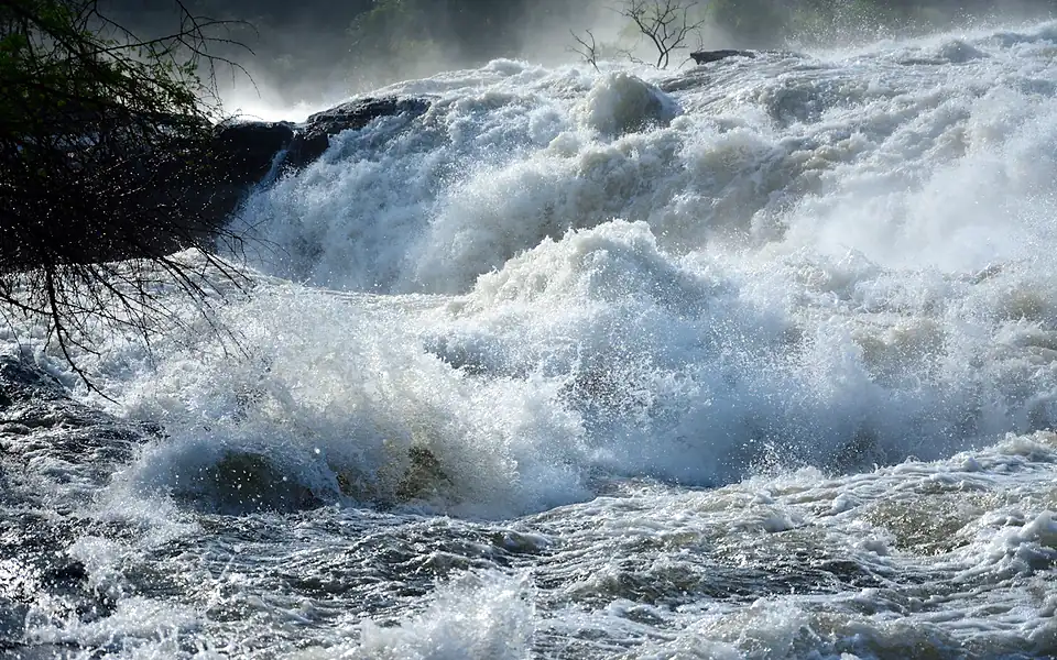 White water rushing over the rocks of the Nile at Murchison Falls